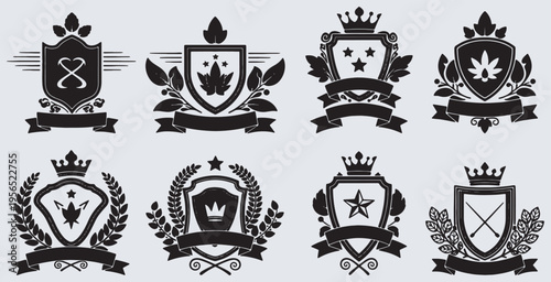 Set of eight elegant black and white heraldic shields with crowns, leaves, and ribbons, perfect for vintage design elements and emblems.