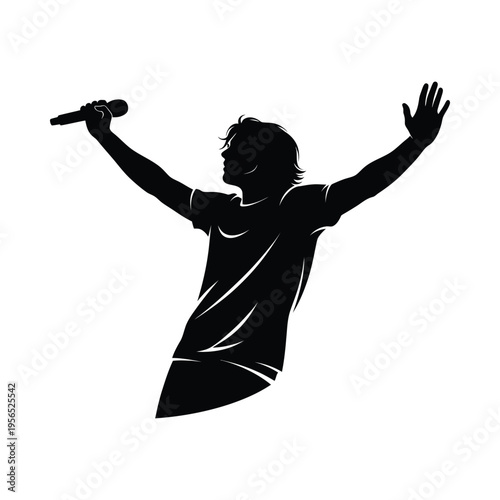 Silhouette of a person holding a microphone, arms raised in celebration or triumph on stage