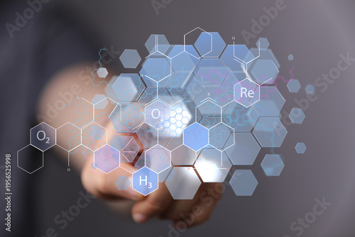 Hand touching science molec...
