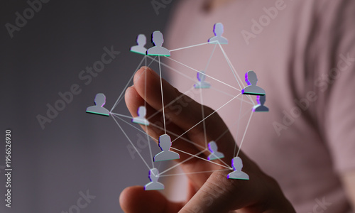 Hand holding network of peo...
