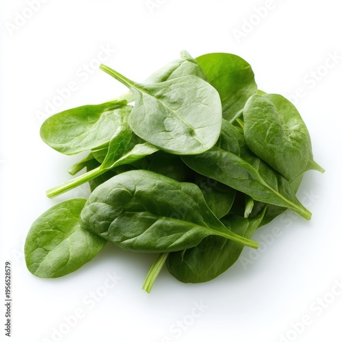 Pile of fresh green baby spinach leaves isolated on white background, close up, healthy food