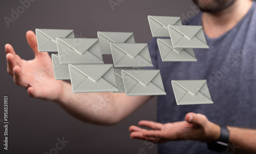 Man holding floating email ...