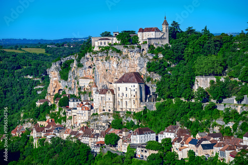 buildings of the pilgrimage site of Rocamadour on a steep rocky cliff in the valley of the Alzou River in Quercy, France