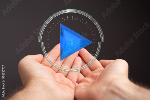 Hands cupping a play button...