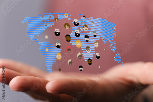 Hand holding world map with...