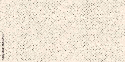 A close up view of a textured beige and white speckled surface