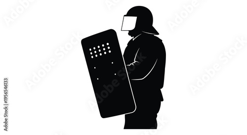 Riot police officer with shield in stark black silhouette
