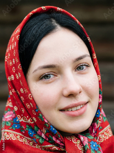 Portrait of a young beautiful woman with a scarf on her head