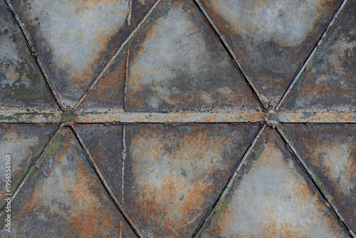 Rusty metal plate with diagonal pattern