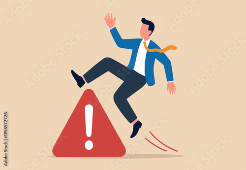 Mistake caution, business risk or problem warning, failure prevention or avoid danger concept, cautious businessman slip falling on exclamation symbol beware, careful caution sign