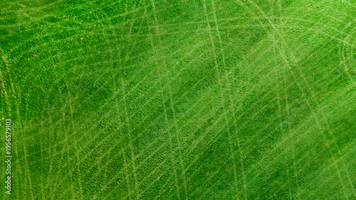 Professional lawn care cross stripes, lush green turf aerial