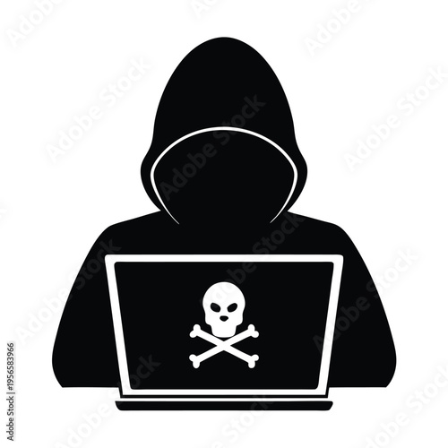 Silhouette of a hooded figure shows skull and crossbones emblem on laptop screen