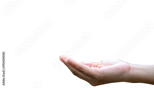 Open hand with a droplet in midair against a stark black background
