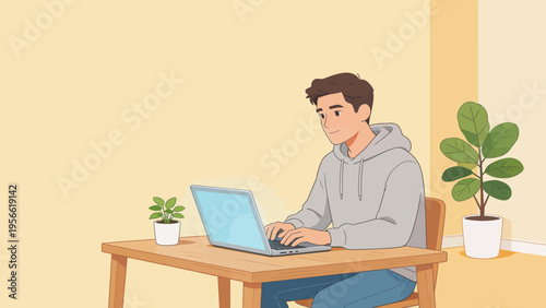 Young man working on laptop at desk