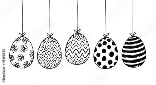 Hand drawn easter eggs with various patterns hanging from strings