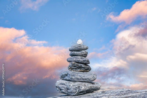 Cairn and Sunset Sky.  Concepts of optimism, harmony, stability, peace, tranquility, restfulness.