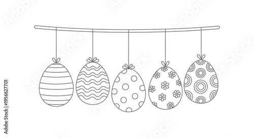 A string of five decorated easter eggs hangs against a white background