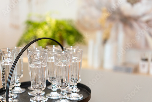 Elegant Glassware Service on Tray with Bokeh Background