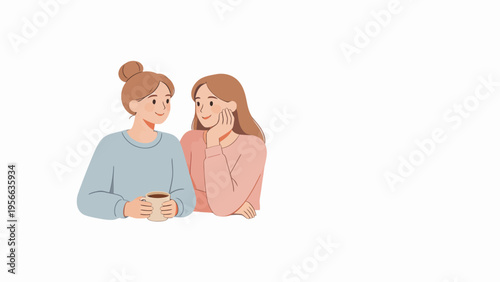 Two women sitting together holding a cup