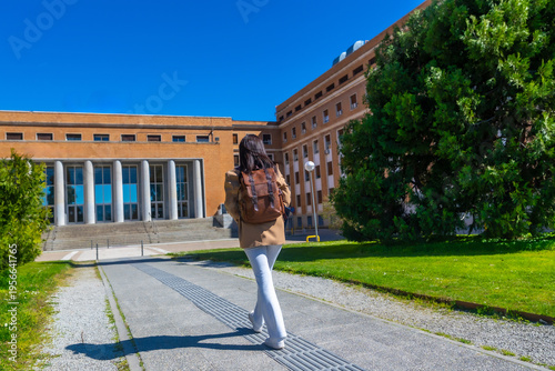 Принти на полотні Student walking to university campus building for education