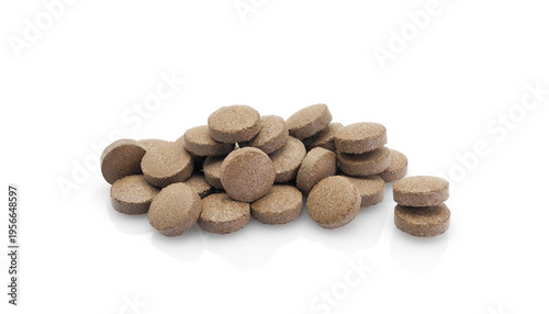 Herbal tablets, dietary supplement, isolated heap on white background