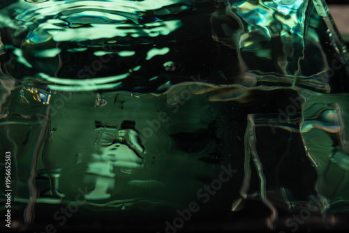 432.Dark Green Liquid With Ripples And Glass Reflections
