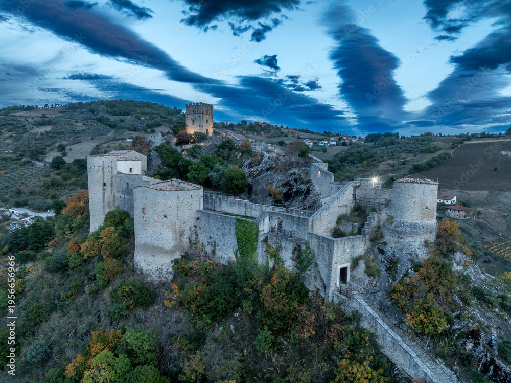 Obraz premium Roccascalegna Castle Lower Walls Towers Courtyard Floodlit Keep Blue Dusk Aerial Abruzzo Italy Medieval