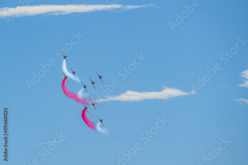 Φωτογραφία A group of aerobatic jet aircraft flying in perfect formation du