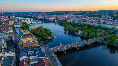 Sunset aerial view of National theatre at Smetanovo nabrezi rive