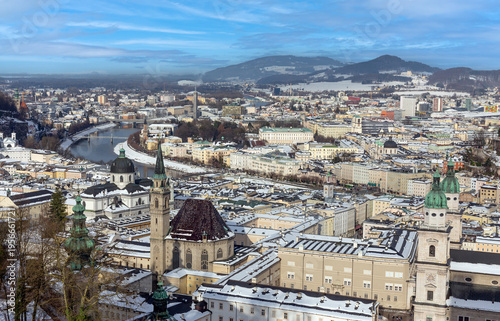 Panoramic winter view of Salzburg old town covered in snow, Austria