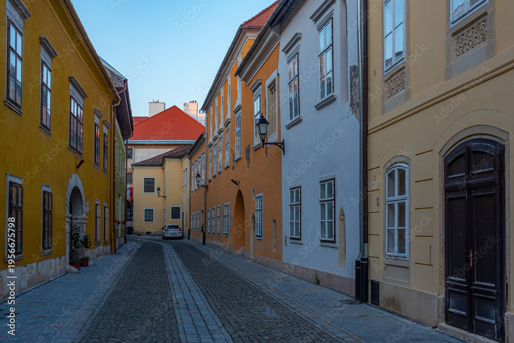 Fototapeta premium Sunrise view of a narrow street in Sopron, Hungary
