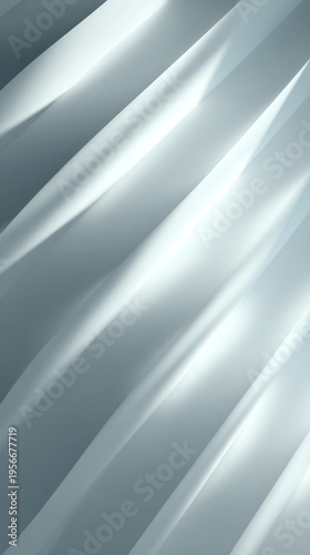 Sleek metallic textures and gentle curves form a contemporary abstract backdrop, perfect for technology or luxury design themes. Subtle highlights and shadows add depth and sophistication to the image