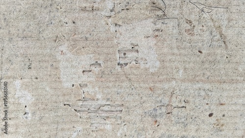 Weathered Damaged Cardboard Texture with Torn Layers and Gritty Paper Surface Background