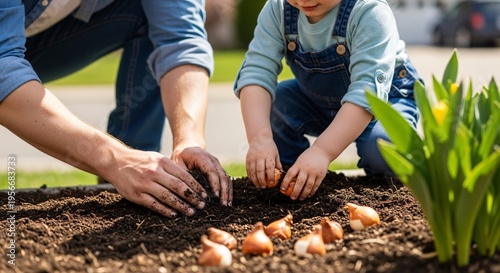 Child and adult planting tulip bulbs in garden soil during spring, hands-on gardening activity with vibrant green shoots.