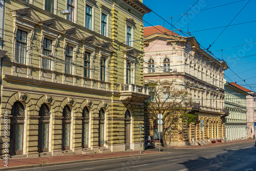 Fotografie Sunrise view of historical houses in Szeged, Hungary