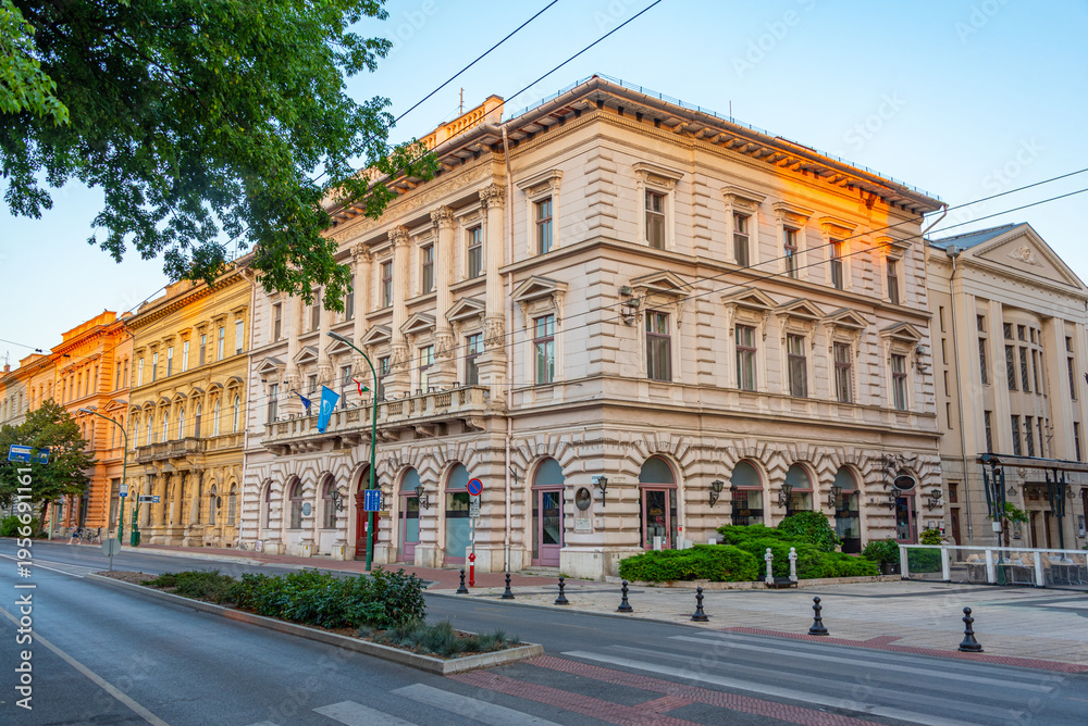 Obraz premium Sunrise view of historical houses in Szeged, Hungary
