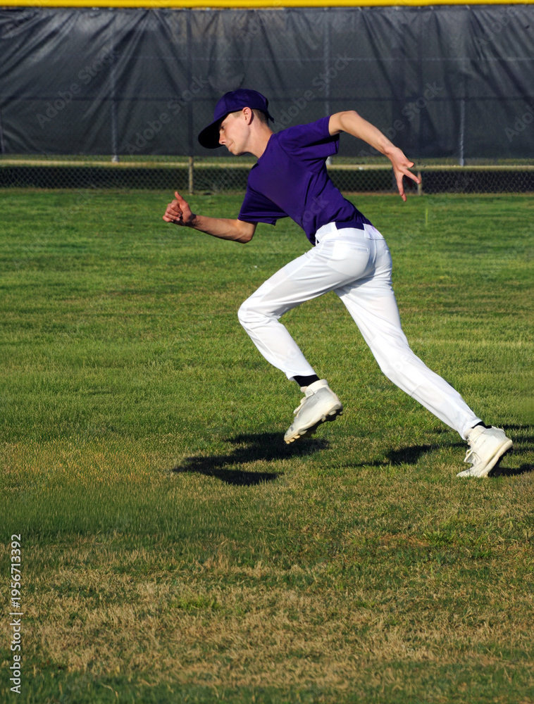 Obraz premium Summer League Baseball Player Wears Purple