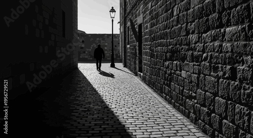 Man walks down sunlit cobblestone alleyway with stone walls and lamppost