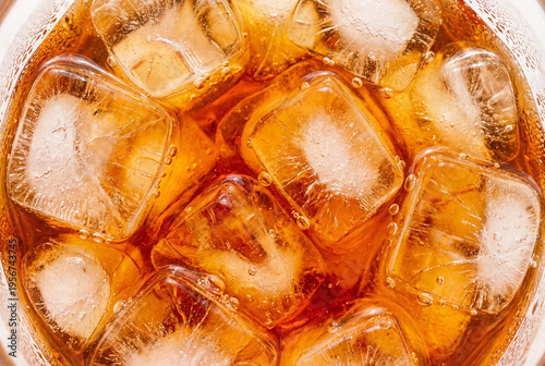 Extreme close up of iced tea with many sparkling clear ice cubes