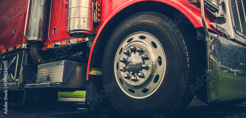 Big Red Truck Parked on Green Grass Near the Road