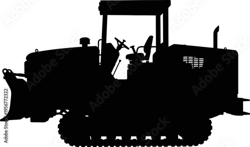 Crawler bulldozer silhouette working on construction site