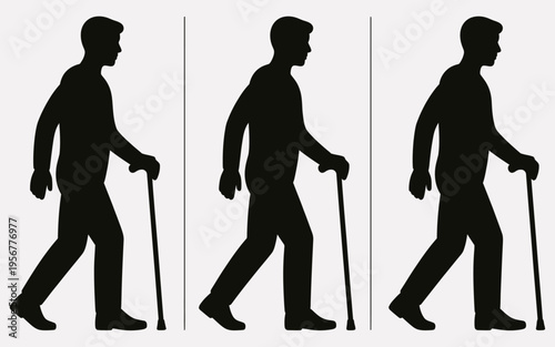 Silhouette of a man walking with cane.