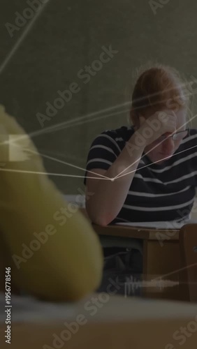 Vertical video: Teen student starting exam, leaning over paper, HUD lines aligning near head