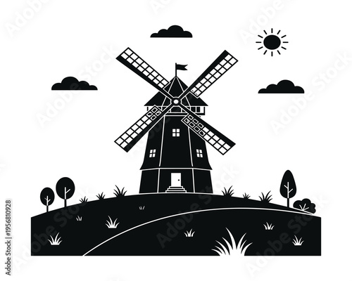 Silhouette of a traditional windmill on a grassy hill under a bright sun and cloudy sky
