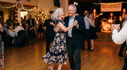 Elderly couple dancing joyfully on wooden floor at a festive gathering  