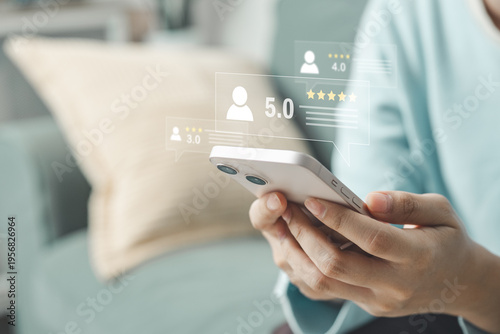 Customer reviewing service on smartphone with five star rating interface representing customer satisfaction, feedback system, online reviews and service evaluation.