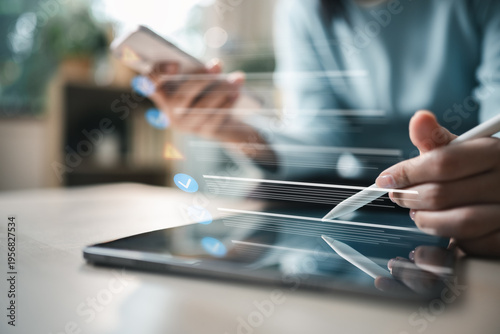 Fotografie User reviewing account login activity and session history on tablet and smartphone