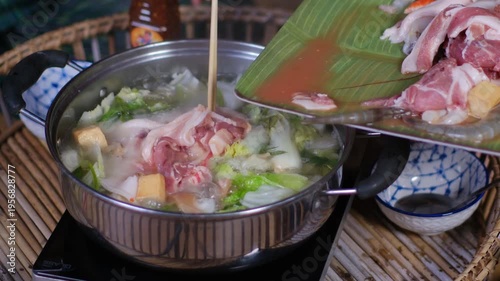 Delicious culinary dish featuring fresh vegetables and meats prepared in a traditional pot, showcasing vibrant colors and rich textures for food lovers.