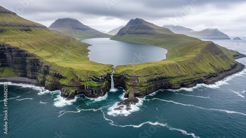 A serene landscape of a lake surrounded by mountains and ocean