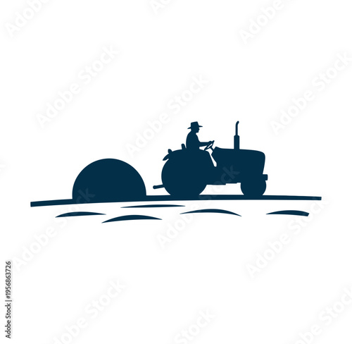 man driving tractor with hay bale on field at sunset